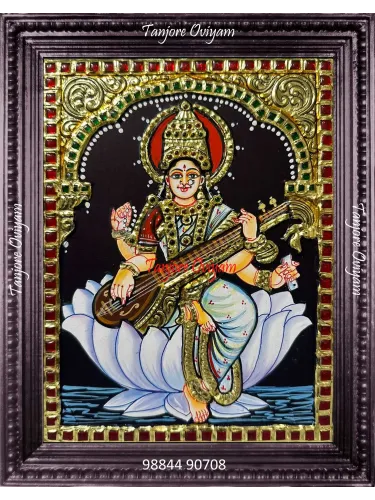 Handcrafted Saraswathi Mata Tanjore painting seated on a lotus with veena and gold foil detailing